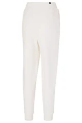 Dámské krémové kalhoty Puma ESS+ Embroidery High-Waist Pants FL