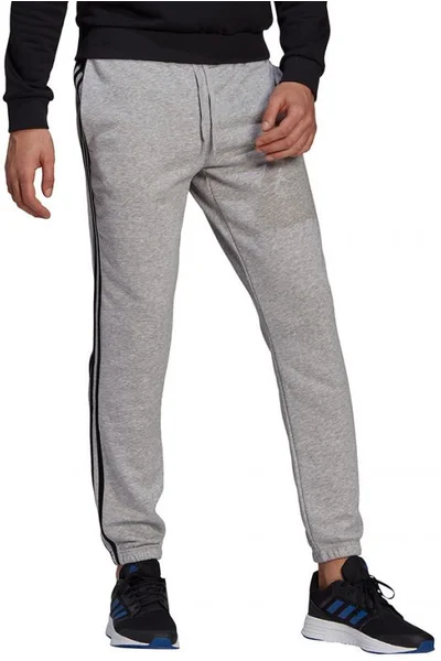 Sportovní pánské kalhoty Adidas šedé s pruhy