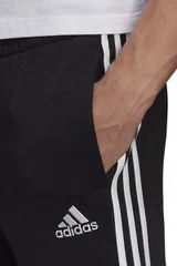 Pánské černé sportovní kalhoty Essentials Tapered Cuff 3 Stripes  Adidas